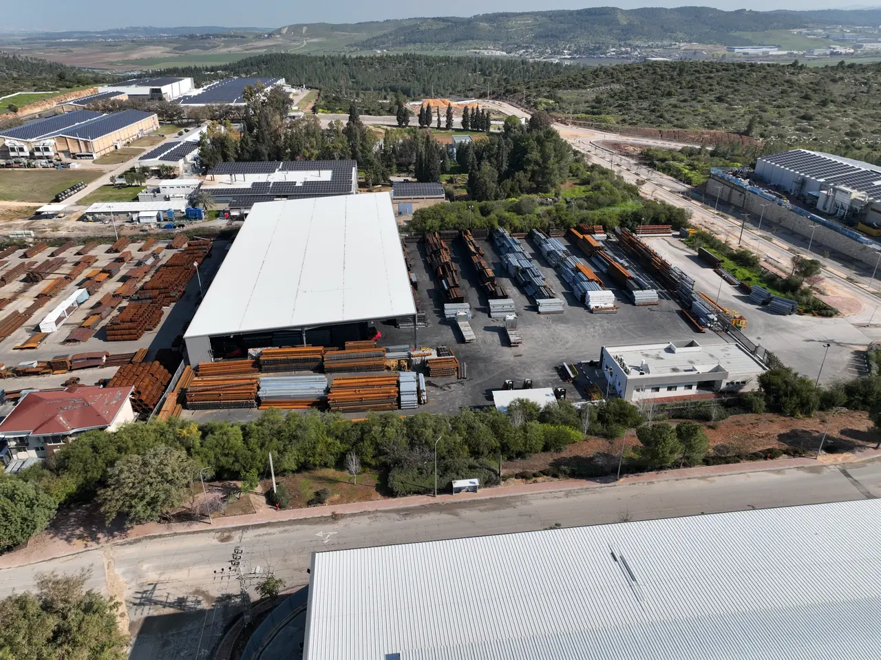 Aerial view of an industrial yard with storage buildings
