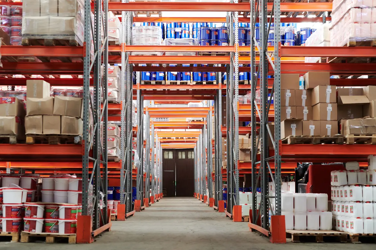 Pallet racking and cartons in a commercial warehouse aisle
